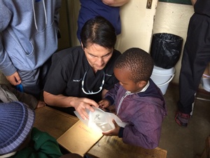 Dr. Marco teaching a young student
